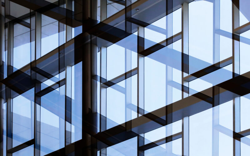 Glass,Wall,With,Metal,Framework.,Reworked,Photo,Of,Office,Building